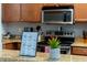 Well-equipped kitchen featuring granite countertops and wooden cabinetry at 3715 Calabria Ave # 0, Davenport, FL 33897