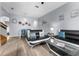 Open living room featuring contemporary sofas and a glass coffee table at 3715 Calabria Ave # 0, Davenport, FL 33897