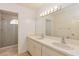 Bathroom with double vanity, large mirror, and shower at 4253 Willow Bay Dr, Winter Garden, FL 34787