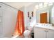 Bright bathroom with white vanity, toilet and shower/tub combo at 4706 Vero Beach Pl, Kissimmee, FL 34746