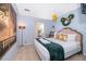 Elegant bedroom with a large bed, unique chandelier, and tranquil decor at 4706 Vero Beach Pl, Kissimmee, FL 34746