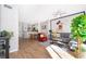 Open living space with Mickey Mouse decor, gray sectional sofa and wood floors at 4706 Vero Beach Pl, Kissimmee, FL 34746