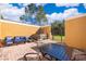 Private patio with hot tub, seating area and dining table at 4706 Vero Beach Pl, Kissimmee, FL 34746