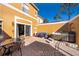Relaxing patio featuring a hot tub and comfortable seating at 4706 Vero Beach Pl, Kissimmee, FL 34746