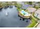 Aerial view showing pool, lake, and building at 4881 Cypress Woods Dr # 3309, Orlando, FL 32811