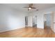 Spacious bedroom with wood flooring and access to bathroom and closet at 4881 Cypress Woods Dr # 3309, Orlando, FL 32811