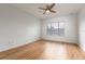 Bright bedroom featuring hardwood floors and a ceiling fan at 4881 Cypress Woods Dr # 3309, Orlando, FL 32811