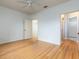 Spacious bedroom with wood flooring and access to bathroom at 4881 Cypress Woods Dr # 3309, Orlando, FL 32811