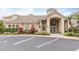 Community clubhouse with inviting landscaping and convenient parking at 4881 Cypress Woods Dr # 3309, Orlando, FL 32811
