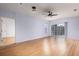 Spacious living room with light walls and laminate floors at 4881 Cypress Woods Dr # 3309, Orlando, FL 32811