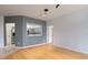 Living room with kitchen pass-through and laminate flooring at 4881 Cypress Woods Dr # 3309, Orlando, FL 32811