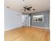 Open living area with kitchen pass-through and wood flooring at 4881 Cypress Woods Dr # 3309, Orlando, FL 32811