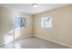 Bright bedroom featuring two windows and tile floors at 5216 Montague Pl, Orlando, FL 32808