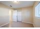 Bedroom with closet, access to bathroom and window at 5216 Montague Pl, Orlando, FL 32808