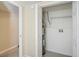 Laundry closet with shelving, water heater, and hookups at 5216 Montague Pl, Orlando, FL 32808