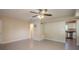 Open living space with a view of the kitchen and access to the sunroom at 5216 Montague Pl, Orlando, FL 32808