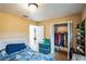 Well-lit bedroom with a double bed and walk-in closet at 526 Gaston Foster Rd, Orlando, FL 32807