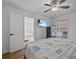 Bedroom with king bed, ceiling fan, and view of another room at 604 Northlake Dr, Sanford, FL 32773