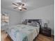 Main bedroom with king bed, ceiling fan, and hardwood floors at 604 Northlake Dr, Sanford, FL 32773