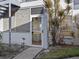 Exterior view showing condo entrance and small patio area at 604 Northlake Dr, Sanford, FL 32773