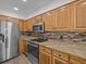 Modern kitchen with granite counters and stainless steel appliances at 604 Northlake Dr, Sanford, FL 32773