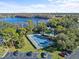 An aerial view of a community tennis court near a lake and pool at 604 Northlake Dr, Sanford, FL 32773