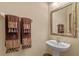 Small bathroom with pedestal sink and decorative towels at 8426 Chamberlain Pl, Oviedo, FL 32765