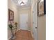 Bright entryway with tile flooring and glass-top accent table at 8426 Chamberlain Pl, Oviedo, FL 32765