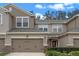 Two-story townhome with attached garage and landscaped front yard at 8426 Chamberlain Pl, Oviedo, FL 32765