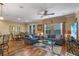 Open living room featuring hardwood floors and comfortable seating at 8426 Chamberlain Pl, Oviedo, FL 32765