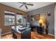 Home office with hardwood floors, large desk, and comfortable chair at 8426 Chamberlain Pl, Oviedo, FL 32765