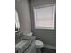 Simple bathroom with granite vanity and updated toilet at 2113 Winnetka Ct, Orlando, FL 32818