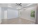 Spacious bedroom with ceiling fan and wood-look flooring at 10952 Arbor View Blvd, Orlando, FL 32825