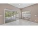 Bright dining area with sliding glass doors leading to a patio at 10952 Arbor View Blvd, Orlando, FL 32825