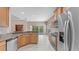 Open concept kitchen with stainless steel appliances and granite countertop at 10952 Arbor View Blvd, Orlando, FL 32825