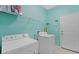 Laundry room with washer, dryer, and shelving at 10952 Arbor View Blvd, Orlando, FL 32825