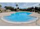 Community pool with plenty of lounge chairs at 10952 Arbor View Blvd, Orlando, FL 32825