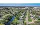 Aerial view of a neighborhood with a house near a canal at 1108 Evangeline Ave, Orlando, FL 32809