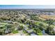 Wide aerial view showing the property and surrounding houses near a waterway at 1108 Evangeline Ave, Orlando, FL 32809