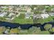 Aerial view of a house by the canal in a residential area at 1108 Evangeline Ave, Orlando, FL 32809