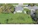 Aerial view showcasing the home's backyard, shed, and water access at 1108 Evangeline Ave, Orlando, FL 32809