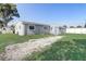 Backyard view of a single-Gathering home with gravel area at 1108 Evangeline Ave, Orlando, FL 32809
