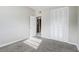 Bright bedroom with carpet, large closet, and door to bathroom at 1108 Evangeline Ave, Orlando, FL 32809