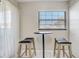 Bright breakfast nook with small table and two wooden stools at 1108 Evangeline Ave, Orlando, FL 32809