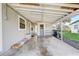 Covered patio with concrete floor and storage at 1108 Evangeline Ave, Orlando, FL 32809