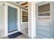Side entrance with two blue doors and window at 1108 Evangeline Ave, Orlando, FL 32809