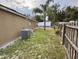 Backyard with a small pool and wooden fence at 1208 Honey Rd, Apopka, FL 32712