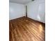 Bright bedroom with wood-look floors and spacious closet at 1208 Honey Rd, Apopka, FL 32712