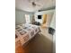 Main bedroom with comfortable bed, TV, and access to bathroom at 1208 Honey Rd, Apopka, FL 32712