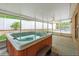 Relaxing hot tub on a screened patio at 1208 Honey Rd, Apopka, FL 32712
